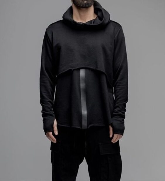 a men in a black, fashion sweatshirt, the sleeves cover the arm like continue gloves