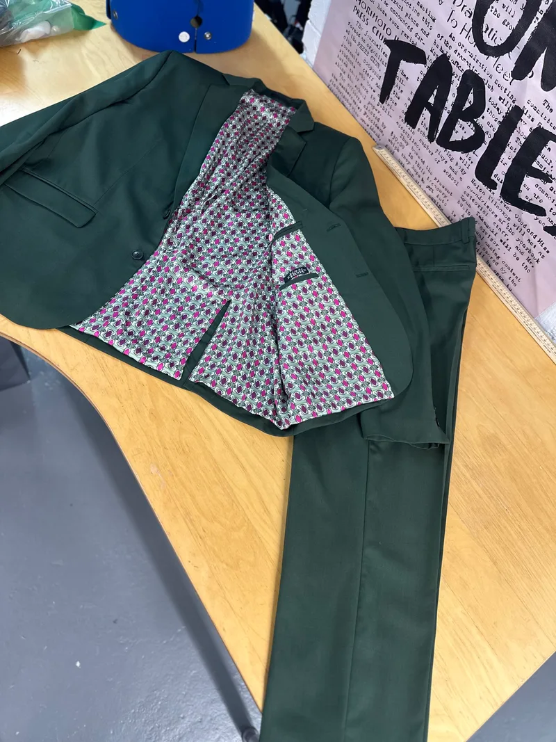 bespoke jacket, revealing a contrasting [colour] lining on the inside