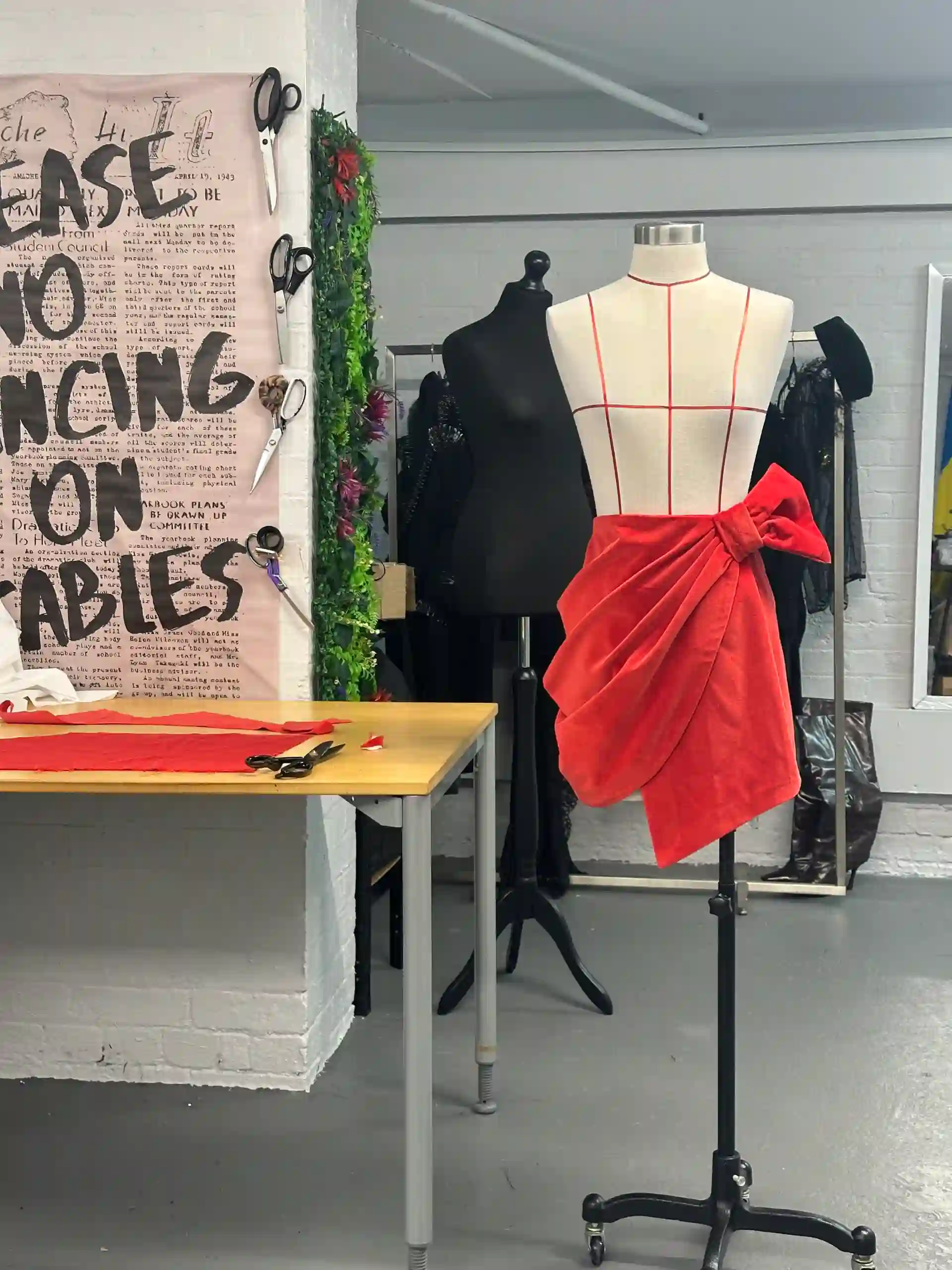 Same Day Alterations: A tailor performing urgent alterations on a skirt in London.