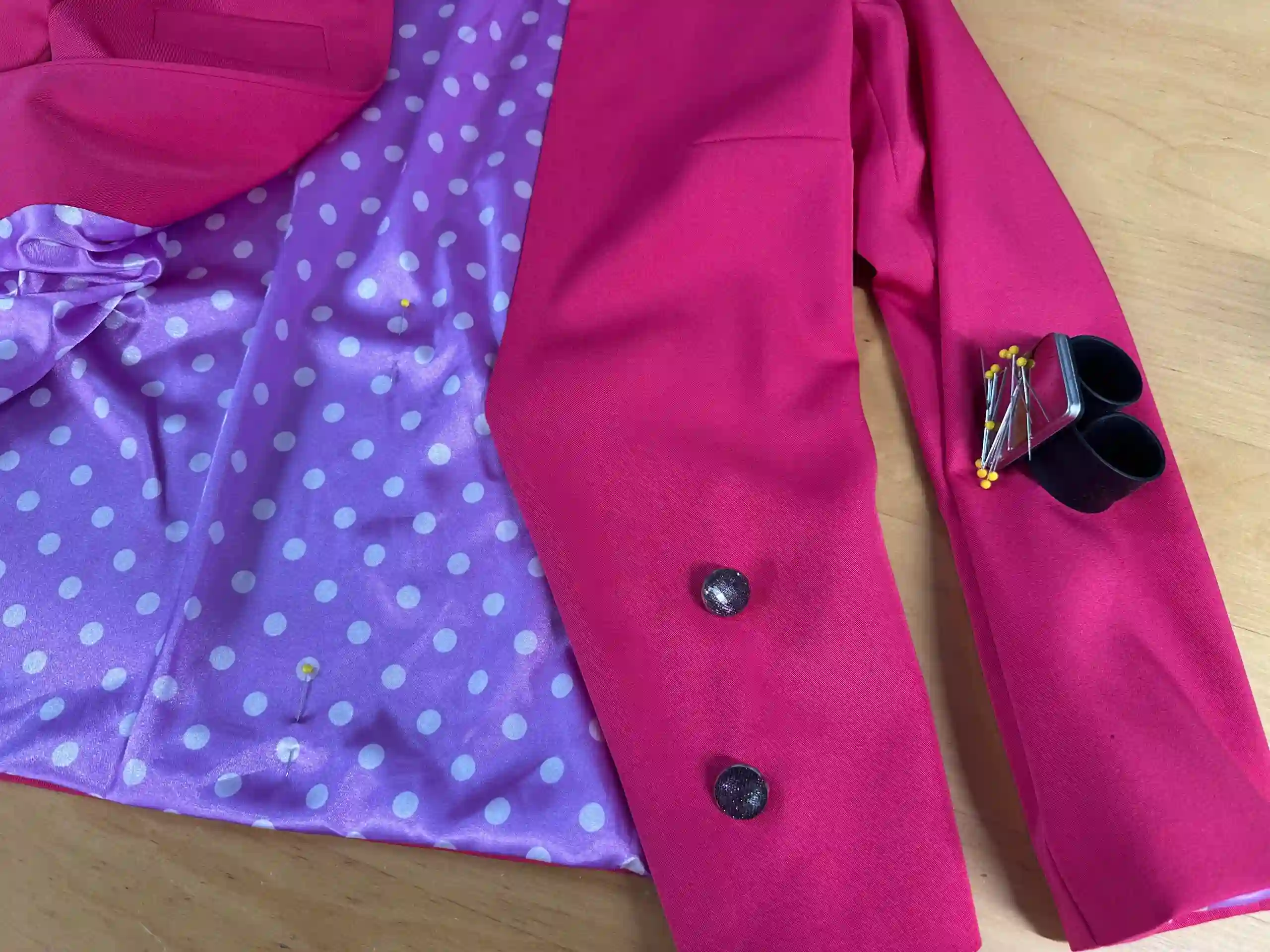 Jacket Relining: A tailor stitching a new lining into a jacket in London